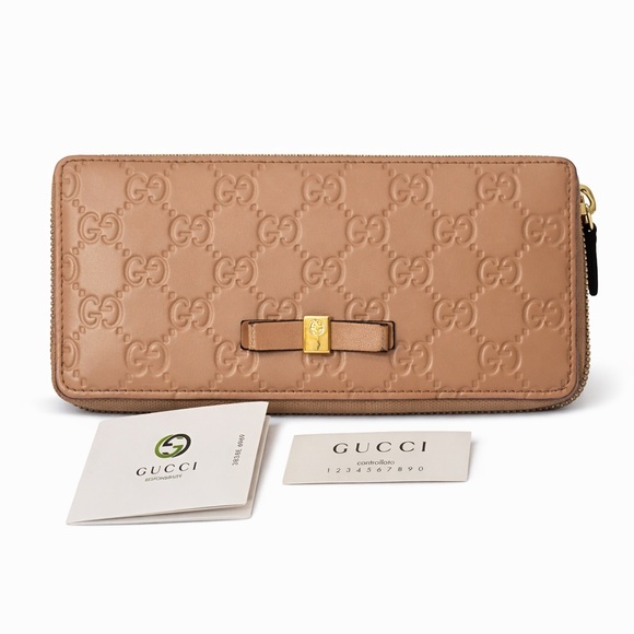 Gucci Handbags - GUCCI GG Embossed Tan Leather Zippy Wallet EUC